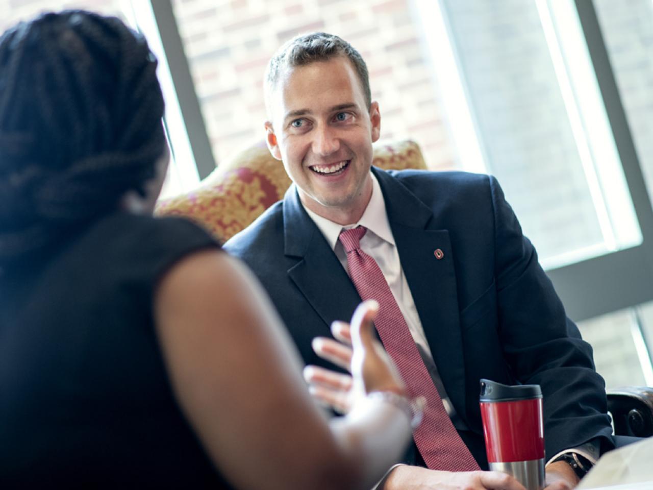 Ohio State University Advancement employees Ben Miller and Courtney Ross chat in the Ohio Union